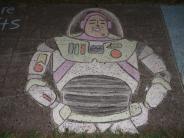 sidewalk chalk art of white astronaut uniform 