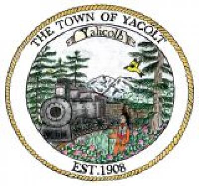 Town of Yacolt seal features a train coming through the woods in front of a mountain